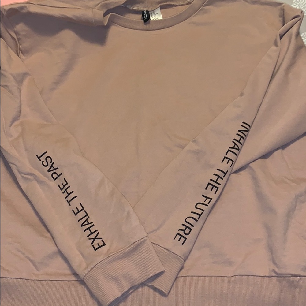 Thin long sleeved sweater.